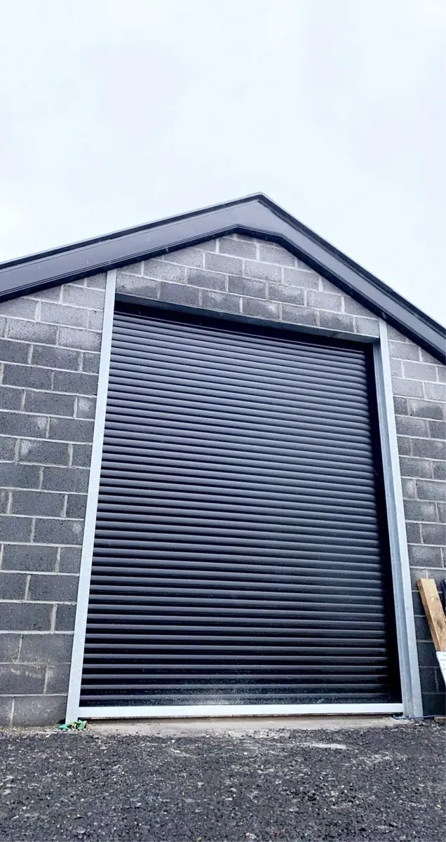 Grey roller door block built garage